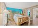 Cozy bedroom featuring wood-look flooring and a full-length mirror to add style and dimension at 6804 N Ocean Blvd. # 1013, Myrtle Beach, SC 29572