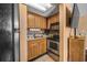 A well-equipped kitchen with appliances and tile backsplash enhances cooking convenience at 6804 N Ocean Blvd. # 1013, Myrtle Beach, SC 29572