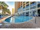 Resort-style outdoor pool with lounge seating; an oasis for recreation and relaxation at 6804 N Ocean Blvd. # 1013, Myrtle Beach, SC 29572