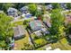 Aerial view of a house featuring a quaint patio, a small garden shed, and lush backyard at 719 Juniper Dr., Myrtle Beach, SC 29575