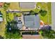 A captivating aerial view showcases the home's roof, patio, and neighboring landscapes and road at 719 Juniper Dr., Myrtle Beach, SC 29575
