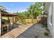 A wooden deck and backyard featuring mature trees, and partially covered space for entertaining or relaxing at 719 Juniper Dr., Myrtle Beach, SC 29575