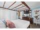 A bedroom with white trim, light blue walls, and an antique four poster bed at 719 Juniper Dr., Myrtle Beach, SC 29575