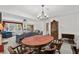 Open dining space with a chandelier, view into the living area, and classic decor at 719 Juniper Dr., Myrtle Beach, SC 29575