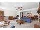 Open living space with a fireplace, wood furnishings, and a view of the dining area and kitchen at 719 Juniper Dr., Myrtle Beach, SC 29575