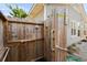 Enclosed outdoor shower with wooden paneling features grab bars and modern shower fixtures for accessibility and convenience at 719 Juniper Dr., Myrtle Beach, SC 29575