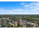 Aerial view showcases the building nestled in a vibrant community with a backdrop of lush greenery at 7509 N Ocean Blvd. # 404, Myrtle Beach, SC 29572