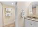 Neutral tone bathroom featuring a single sink vanity and walk in tile shower at 7509 N Ocean Blvd. # 404, Myrtle Beach, SC 29572