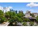 Attractive building view showcasing surrounding landscaping and a peek of the ocean at 7509 N Ocean Blvd. # 404, Myrtle Beach, SC 29572