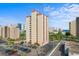Beautiful exterior view of condo building featuring ample parking and lush green landscaping at 7509 N Ocean Blvd. # 404, Myrtle Beach, SC 29572