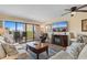 Living room area opens to a large sunny balcony with beautiful views of the city and beach at 7509 N Ocean Blvd. # 404, Myrtle Beach, SC 29572