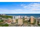 Expansive ocean view featuring a beautiful blue skyline and surrounding buildings at 7509 N Ocean Blvd. # 404, Myrtle Beach, SC 29572