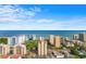 Expansive ocean view featuring a beautiful blue skyline and surrounding buildings at 7509 N Ocean Blvd. # 404, Myrtle Beach, SC 29572