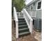 Back porch stairs feature white railings with painted green steps and risers, next to HVAC unit at 803 34Th Ave. S, North Myrtle Beach, SC 29582