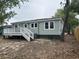 Rear view of the house, showcasing the back deck and well-maintained exterior at 803 34Th Ave. S, North Myrtle Beach, SC 29582