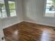 Bright bedroom featuring hardwood floors and two windows for natural light at 803 34Th Ave. S, North Myrtle Beach, SC 29582