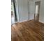 Hallway with hardwood floors, neutral paint, beadboard accent, and access to other rooms at 803 34Th Ave. S, North Myrtle Beach, SC 29582