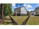 Spacious fenced backyard with lush green lawn and a deck at 854 Falkirk St., Myrtle Beach, SC 29579