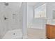 Bright bathroom features marble shower, soaking tub, and white countertop vanity at 854 Falkirk St., Myrtle Beach, SC 29579