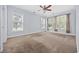 Spacious carpeted bedroom with natural light from multiple windows and a ceiling fan at 854 Falkirk St., Myrtle Beach, SC 29579