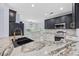 Updated kitchen with granite countertops, stainless steel appliances, and modern cabinetry at 854 Falkirk St., Myrtle Beach, SC 29579