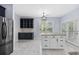 Bright eat-in kitchen featuring an island, stone countertops, custom cabinets, and stainless appliances at 854 Falkirk St., Myrtle Beach, SC 29579