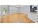 Open living room with hardwood floors and a view to the modern kitchen and outdoor patio at 854 Falkirk St., Myrtle Beach, SC 29579