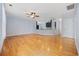 Open concept living room with hardwood floors, a ceiling fan, and a view into the updated kitchen at 854 Falkirk St., Myrtle Beach, SC 29579