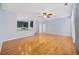 Spacious living area with hardwood floors and a view into the modern kitchen with granite countertops at 854 Falkirk St., Myrtle Beach, SC 29579