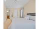 Comfortable bedroom featuring a queen bed and a view into the bathroom at 8546 San Marcello Dr. # 1-102, Myrtle Beach, SC 29579