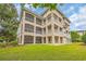 A low angle exterior shot of the back of a multi-story condo with balconies at 8546 San Marcello Dr. # 1-102, Myrtle Beach, SC 29579