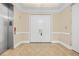A stunning foyer with tile floors, elevator, and white double doors at 8546 San Marcello Dr. # 1-102, Myrtle Beach, SC 29579