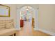 Elegant hallway featuring arched columns, a decorative console table, and warm neutral tones at 8546 San Marcello Dr. # 1-102, Myrtle Beach, SC 29579