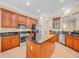 Spacious kitchen with granite countertops, custom cabinetry, and stainless steel appliances at 8546 San Marcello Dr. # 1-102, Myrtle Beach, SC 29579