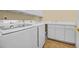 Well-lit laundry room featuring modern Samsung washer and dryer, complemented by ample counter space and storage at 8546 San Marcello Dr. # 1-102, Myrtle Beach, SC 29579
