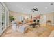 Bright and airy living room with comfortable seating, tile floors, and seamless access to outdoor spaces at 8546 San Marcello Dr. # 1-102, Myrtle Beach, SC 29579