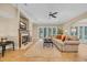 Cozy living room with a fireplace, plush sofa, and sliding glass doors to the outdoors at 8546 San Marcello Dr. # 1-102, Myrtle Beach, SC 29579
