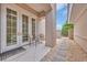 Private patio featuring a small table and chairs, with stone pathway leading to the property's backyard at 8546 San Marcello Dr. # 1-102, Myrtle Beach, SC 29579