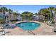 Relaxing community pool with sun loungers and lush landscaping, perfect for enjoying sunny days at 8546 San Marcello Dr. # 1-102, Myrtle Beach, SC 29579