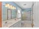 Spacious bathroom features double sinks, vanity, and shower with glass doors at 934 Tiffany Ln., North Myrtle Beach, SC 29582