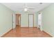 Well-lit bedroom features a ceiling fan, wood flooring, and neutral paint at 934 Tiffany Ln., North Myrtle Beach, SC 29582