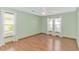 Bright bedroom with hardwood floors, neutral paint, and large windows at 934 Tiffany Ln., North Myrtle Beach, SC 29582