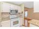 Kitchen with white appliances, granite countertops, and tile backsplash at 934 Tiffany Ln., North Myrtle Beach, SC 29582