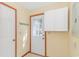 Mud room features white cabinets, a white door and access to the exterior with a glass paneled door at 934 Tiffany Ln., North Myrtle Beach, SC 29582