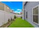The side yard features a well-maintained lawn, fence, and mature landscaping at 934 Tiffany Ln., North Myrtle Beach, SC 29582