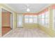Bright sunroom features tile floors, multiple windows and beadboard accents at 934 Tiffany Ln., North Myrtle Beach, SC 29582