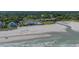 Aerial view of ocean front property with beach access, pools, and golf course at 9340 Lake Dr., Myrtle Beach, SC 29572