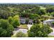An aerial view of a charming home nestled among trees, close to a golf course at 9340 Lake Dr., Myrtle Beach, SC 29572