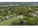 Aerial view of golf course featuring pristine greens and a nearby lake at 9340 Lake Dr., Myrtle Beach, SC 29572