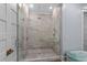 Walk-in shower with glass door, rain shower head, and tiled walls at 9340 Lake Dr., Myrtle Beach, SC 29572